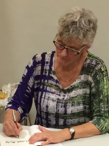 Jane signing copies at the book launch. Photo copyright: Jane McDermott